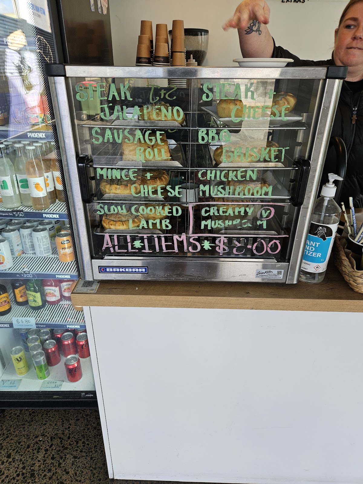 The pie warmer with the day's handwritten flavour list
